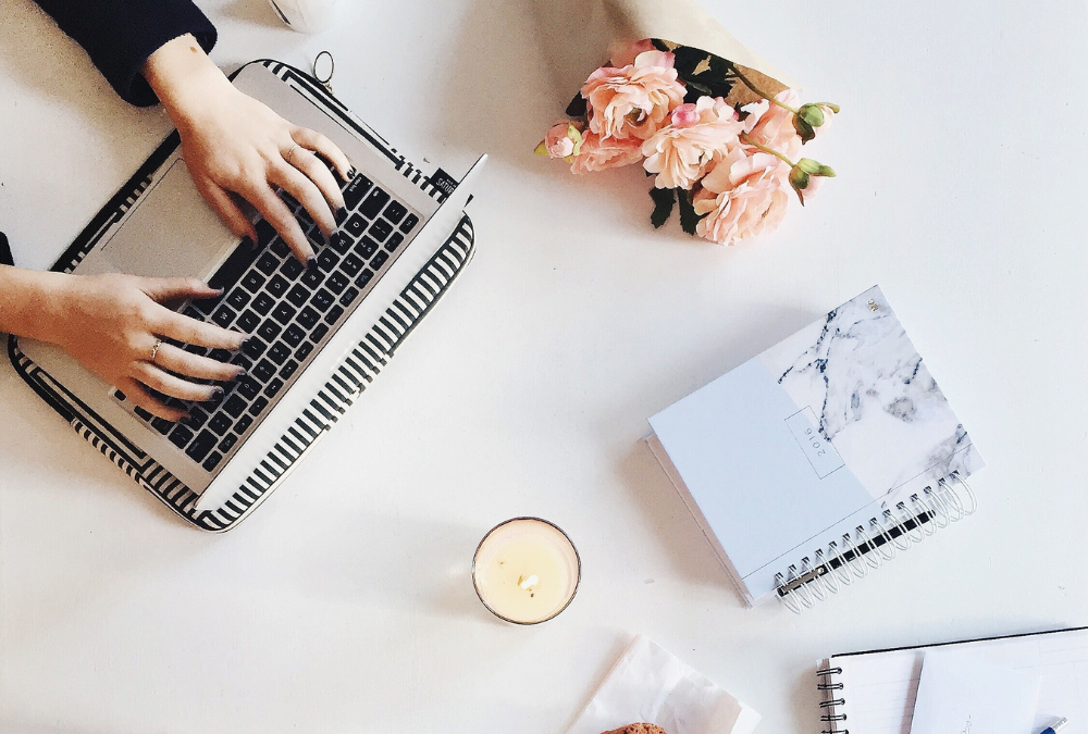 Hands working on laptop. Blog post about if you need to invest in marketing